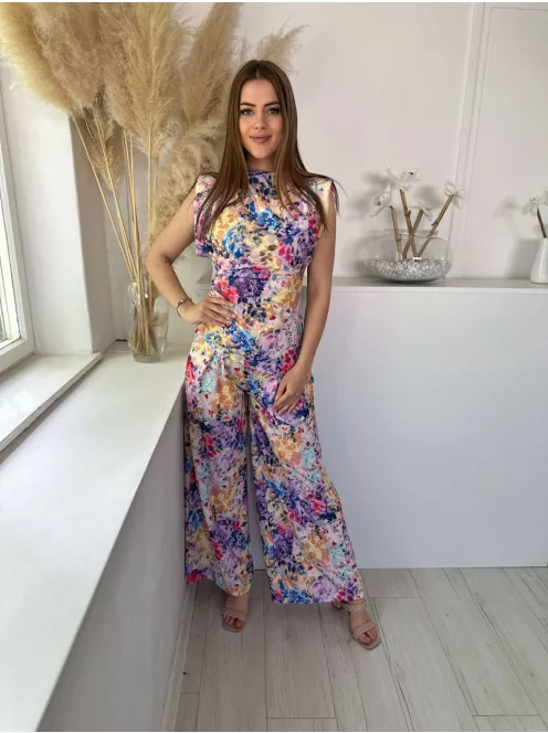 Rugalmas anyagú, kétrészes szett. Aszimmetrikus, válttöméses, oldalán húzott felső, magas, gumis derekú, zsebes, lenge nadrággal. (S-L méretre ajánljuk.)