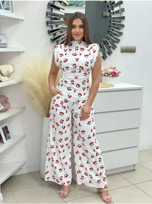 Rugalmas anyagú, kétrészes szett. Aszimmetrikus, válttöméses, oldalán húzott felső, magas, gumis derekú, zsebes, lenge nadrággal. (S-L méretre ajánljuk.)