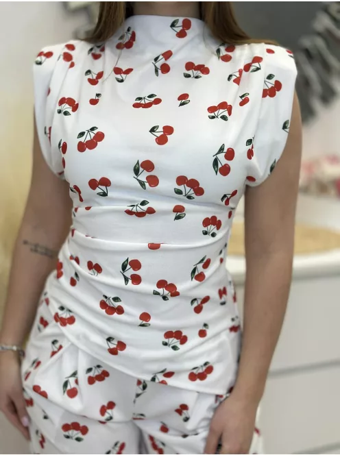 Rugalmas anyagú, kétrészes szett. Aszimmetrikus, válttöméses, oldalán húzott felső, magas, gumis derekú, zsebes, lenge nadrággal. (S-L méretre ajánljuk.)