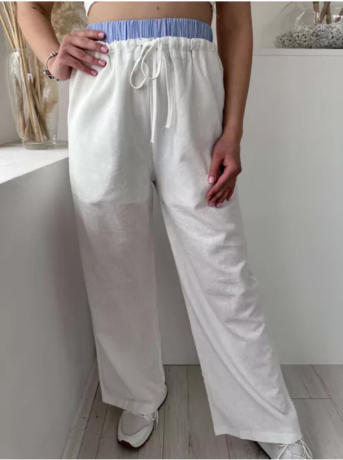 Lenvászon hatású, magas, gumis derekú, nem rugalmas anyagú, lenge fazonú, zsebes nadrág. A Modell S/M méretet visel. (S/M és L/XL méretekben.)