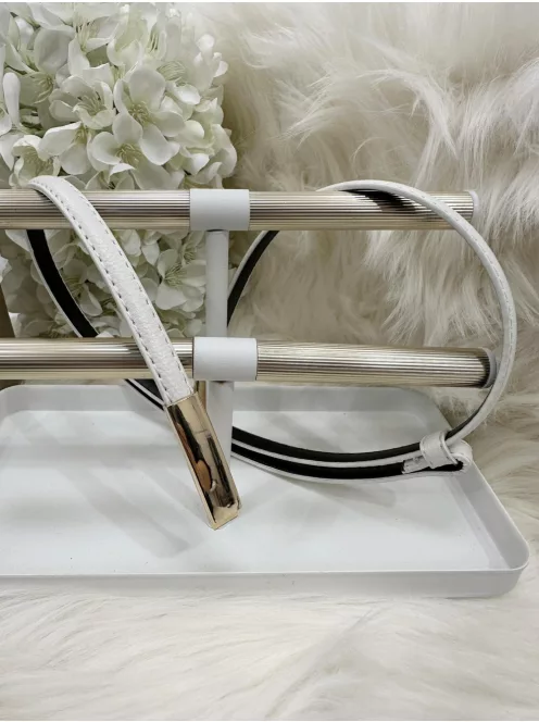 Műbőr, vékony, állítható fémcsatos öv.