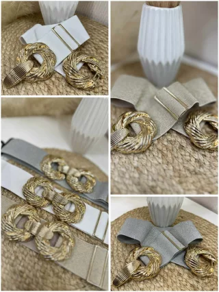   Rugalmas, vastag, gumis, állítható méretű, fém csatos öv.