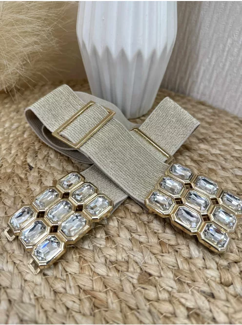 Rugalmas, gumis, állítható méretű, kövekkel díszített, fémcsatos öv.