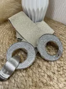 Rugalmas, csillogós, gumis, kövekkel díszített öv .