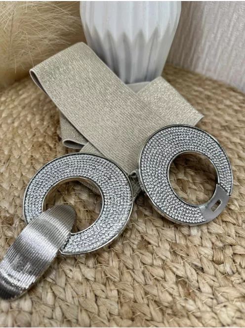 Rugalmas, csillogós, gumis, kövekkel díszített öv .