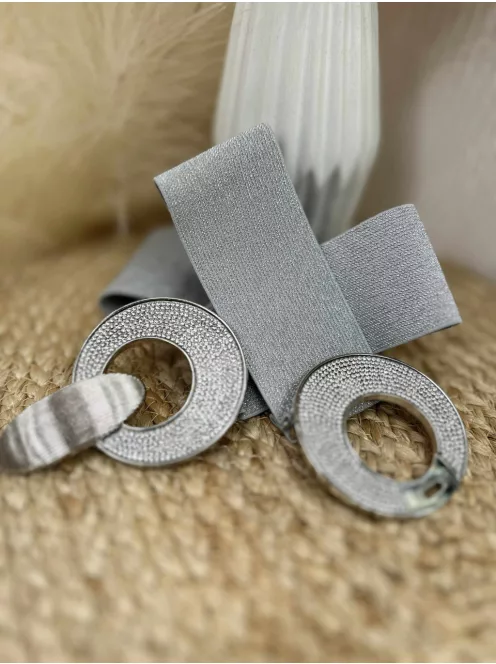 Rugalmas, csillogós, gumis, kövekkel díszített öv .