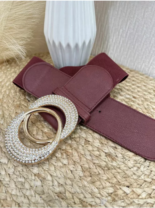 Rugalmas, gumis, kövekkel díszített öv .