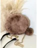 Pihe-puha szőrmés, kerek kistáska hosszúpánttal. 20 cm.