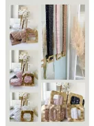 Extra rugalmas, flitterekkel díszített fémcsatos öv.