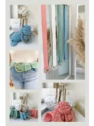 Nem rugalmas, fonott, csatos öv.