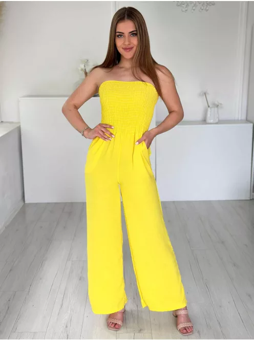 Lenge, egyenes szárú, felsú része gumírozott, nem rugalmas anyagú, zsebes, pánt nélküli overál. (S-L méretre ajánljuk.)